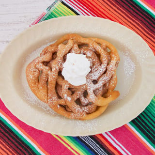Funnel Cake with Powder Sugar and Whipped Cream